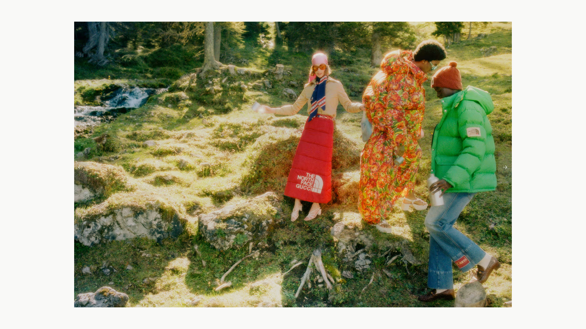Models wearing colorful pieces from The North Face and Gucci collaboration in a mountain landscape